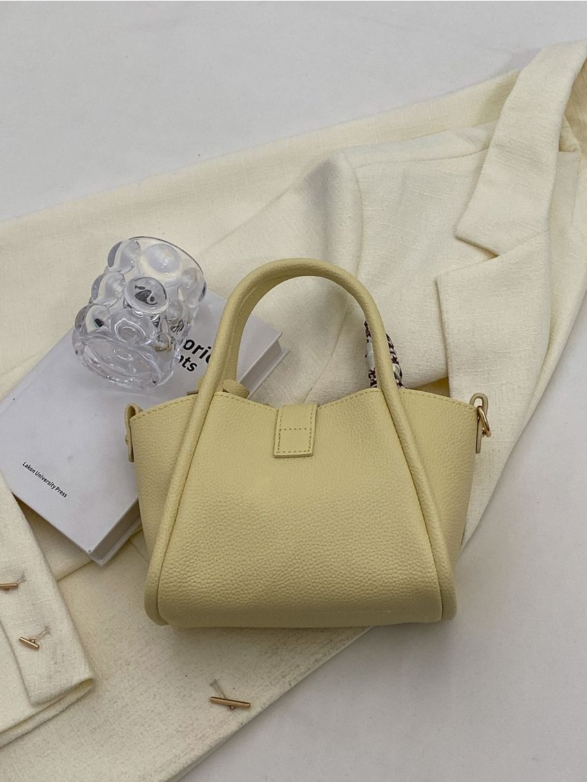 Mini Litchi Embossed Twist Lock Bucket Bag With Bag Charm