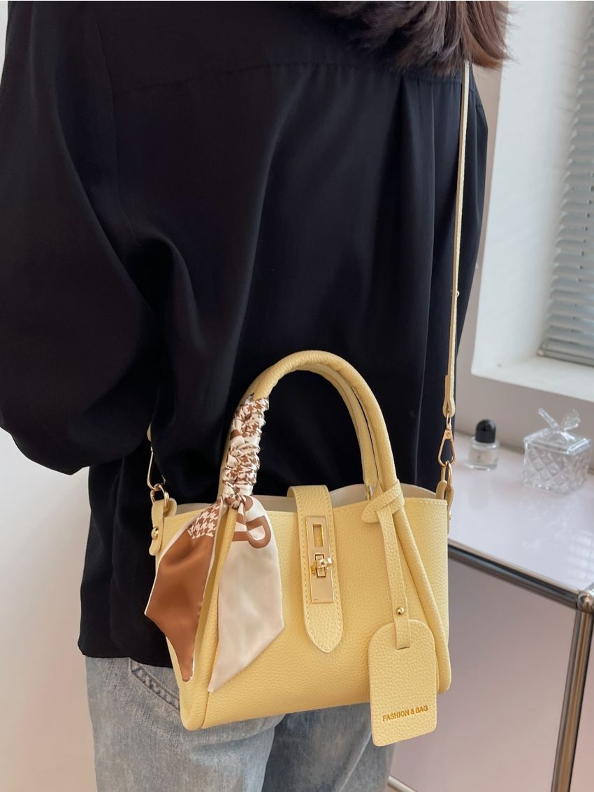Mini Litchi Embossed Twist Lock Bucket Bag With Bag Charm
