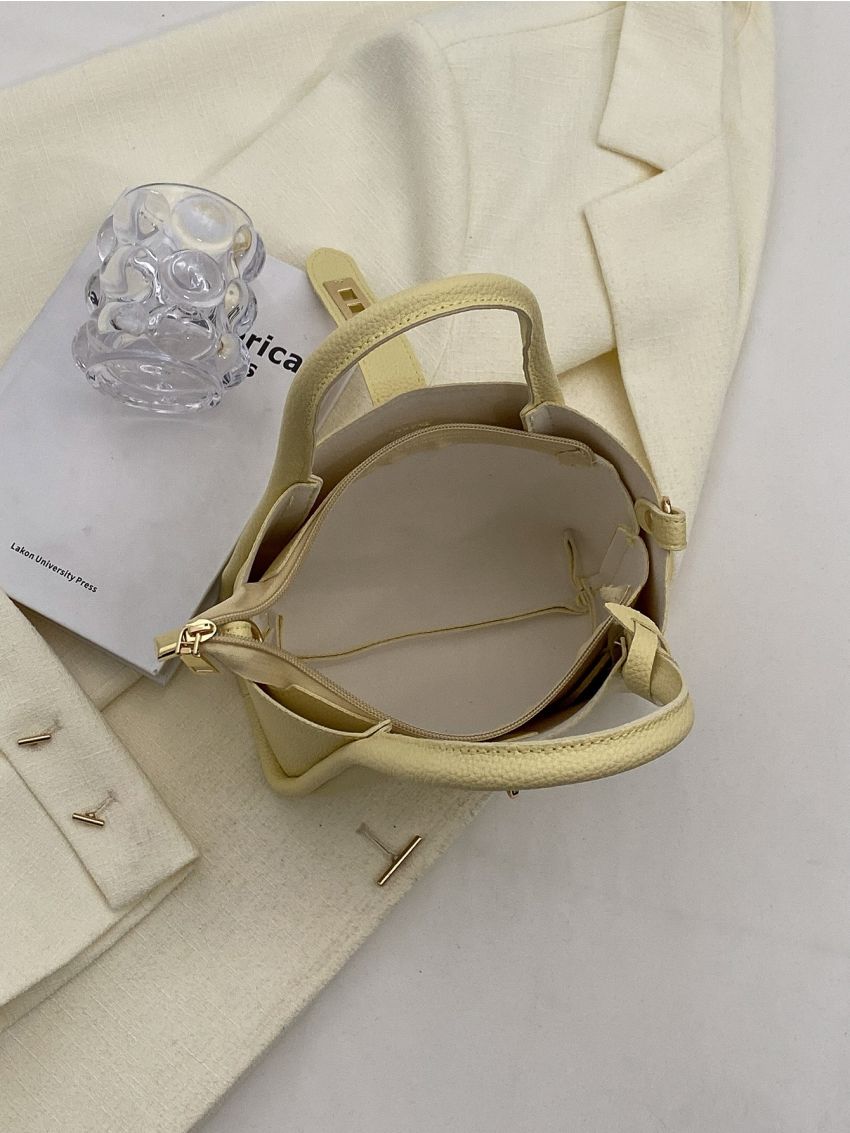 Mini Litchi Embossed Twist Lock Bucket Bag With Bag Charm