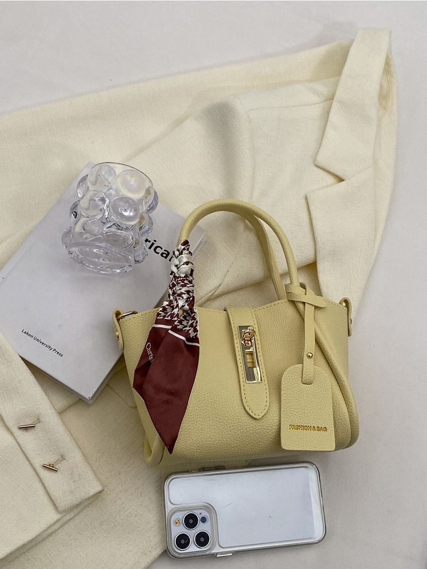 Mini Litchi Embossed Twist Lock Bucket Bag With Bag Charm